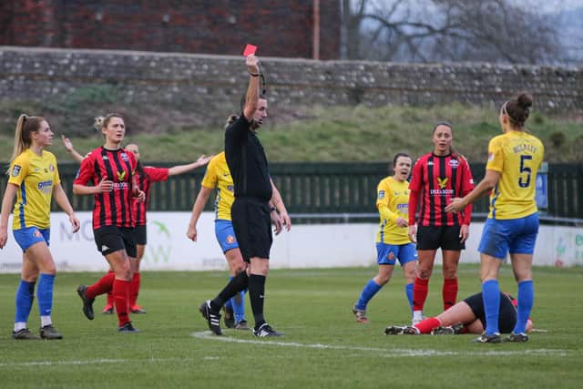 Sunderland's Grace McCatty (far right) is shown a straight red card after a foul on Lewes' Georgia Timms