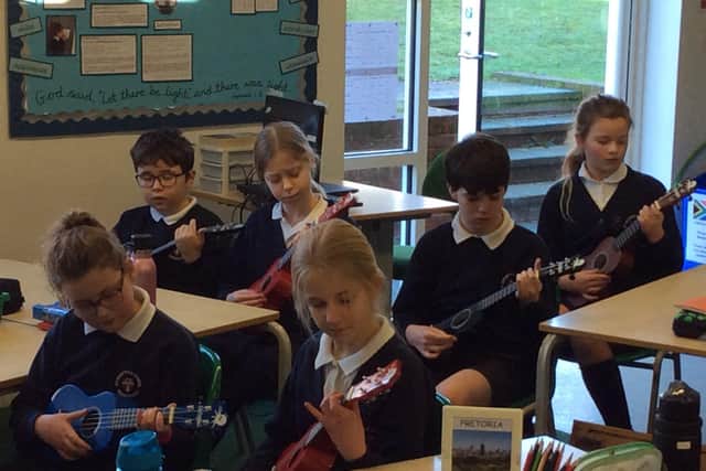 St Mary’s Primary School children at their Ukulele lesson.