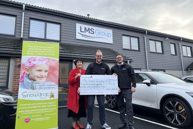 The Sussex Snowdrop Trust chairman and co-founder Di Levantine receives the cheque for £9,018.60 from LMS Group founder and chief executive Luke Mead and operations manager Chris Pegrum