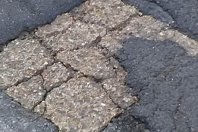 The pothole on Pound Street in Petworth has left one resident particularly concerned. Pic courtesy of Jeremy Edwardes SUS-220124-154707001