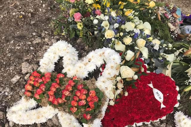 The 73-year-old’s funeral flowers were destroyed and left in a pile, after digger was said to have driven over her grave.