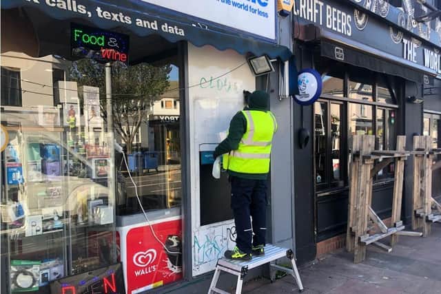 Graffiti being removed by the council team in London Road as part of a trial project. Usually the council will only remove offensive graffiti or graffiti on council property