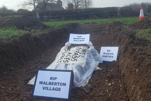 An environmental campaigner, with links to Extinction Rebellion, staged a fake burial in Binsted.