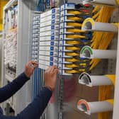 Openreach engineer works on the new Full Fibre network at an exchange: When work is finished, people living and working in Uckfield will be able to contact their broadband provider and upgrade to Full Fibre broadband.