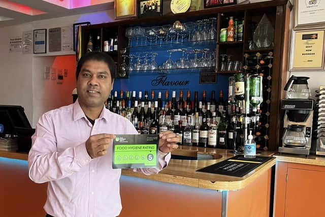 Flavour owner Mustak Miah in Burgess Hill with his new five-star hygiene rating. Picture: Flavour.