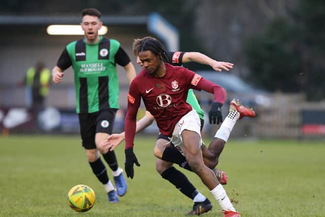 Andrew Sesay on the ball in Hastings' loss to Burgess Hill / Picture: Scott White