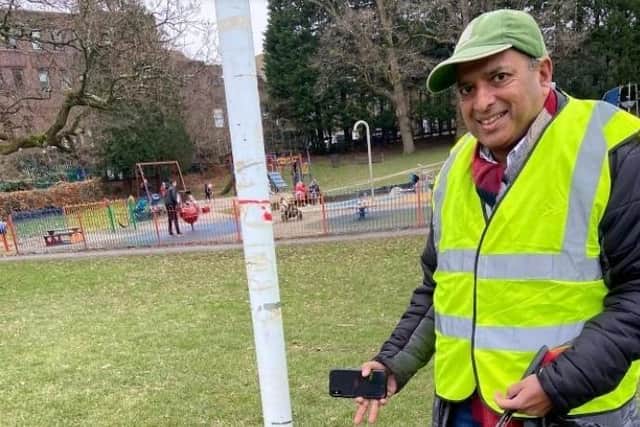 Councillor Sujan Wickremarachi joins in the fight to keep Victoria Park litter free. Picture: Haywards Heath Town Council.