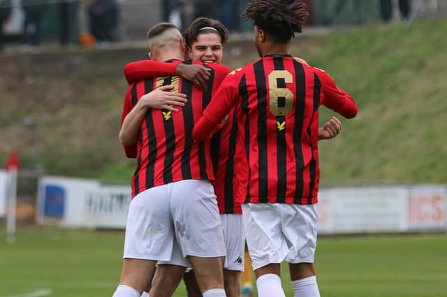 Ollie Tanner - centre - is congratulated after firing in a free-kick in Lewes' win over Merstham earlier this month / Picture: James Boyes