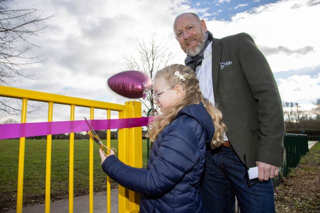 George Turner, with daughter Harriet, opened the newly renovated recreation ground in memory of his late wife Verity Turner. Photo by Alex Shute PPP-220129-121035006