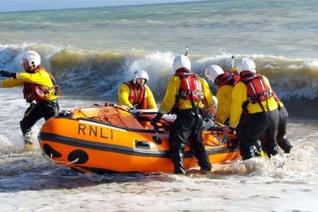 The Eastbourne RNLI crew with the inshore lifeboat. Picture from RNLI/Carl Pocock SUS-220131-111323001