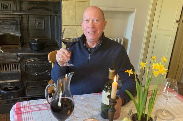 Richard Esling enjoying some red wine