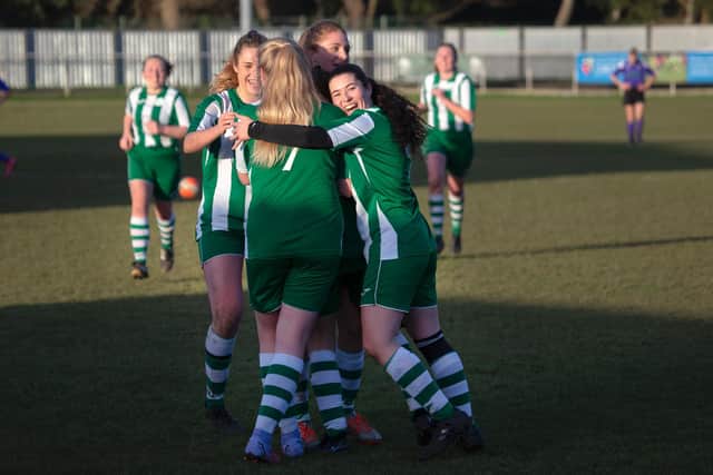 Chichester City Women hug after Katie Bundy's goal / Picture: Neil Holmes