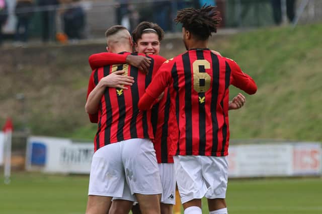 Ollie Tanner, centre, is congratulated after a Lewes goal - he has scored 15 this season / Picture: James Boyes