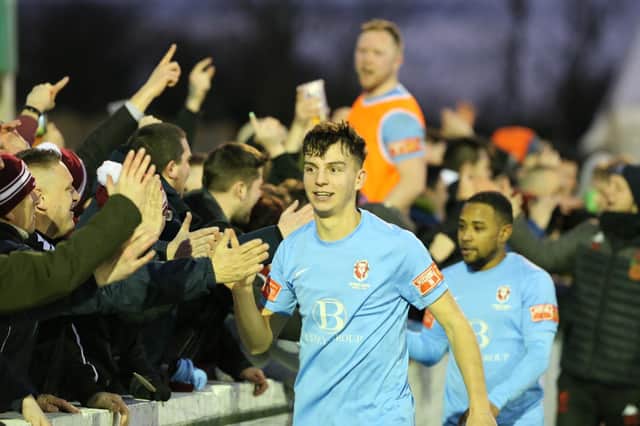 United's players with their fans after the win at Ashford / Picture: Scott White