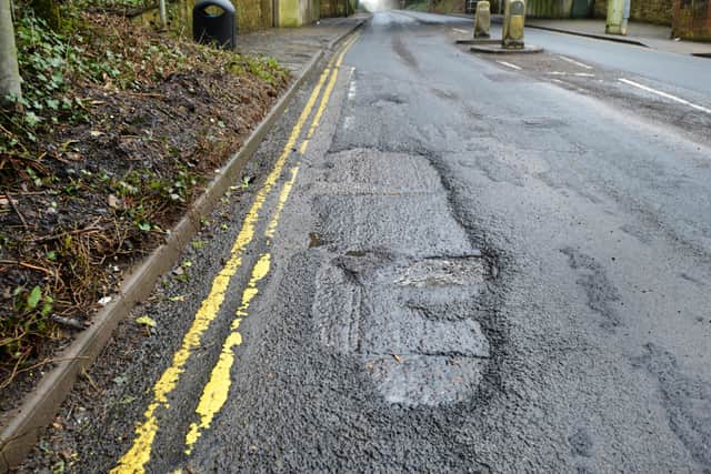 Poor road condition on Battle Road, St Leonards. SUS-201003-140758001