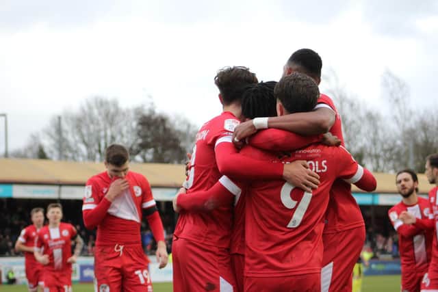 Reds players celebrate Tom Nichols' opener. Picture by Cory Pickford