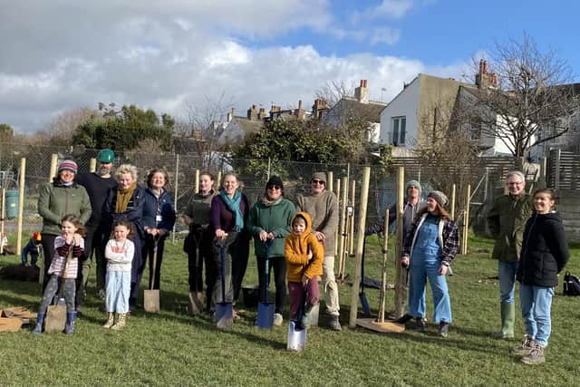 Friends of the Meads planting a new community orchard with a variety of fruit trees