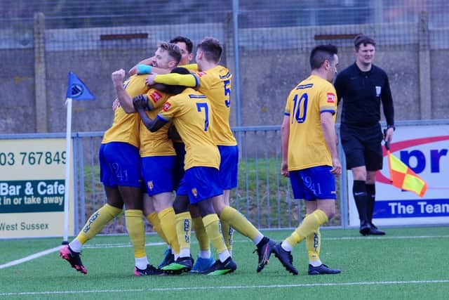 Lancing - pictured celebrating against Three Bridges last week - were jubilant again after getting a late winner at Sevenoaks / Picture: Stephen Goodger