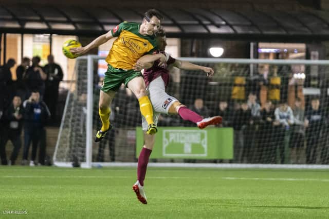 Gary Charman goes up for a header in Horsham's clash with Bognor, one of his former sides. earlier this season / Picture: Lyn Phillips
