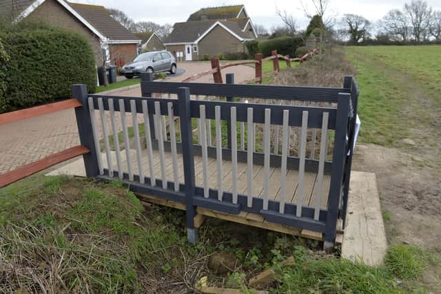 Wooden bridge behind Spur Road in Polegate which developers are going to remove (Photo by Jon Rigby) SUS-220902-111449008