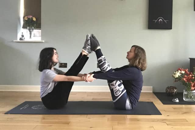 Tracy and 13-year-old daughter Amy encourage practicing yoga to improve mental health.
