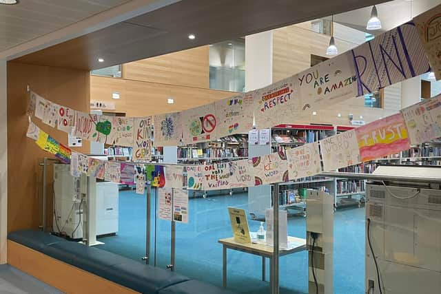 Children's posters turned into a Wall of Kindness at Brighton's Jubilee ...