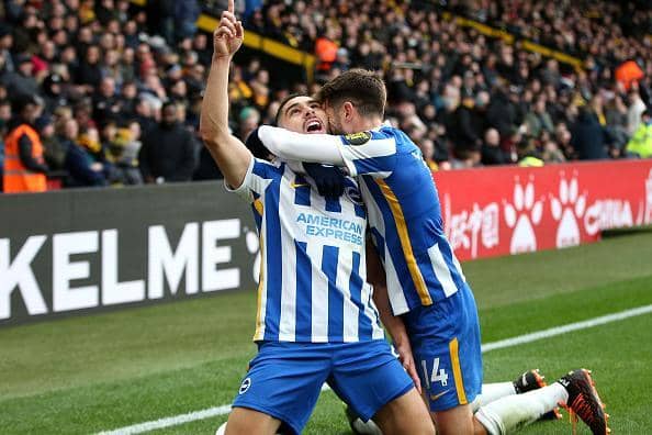 Neal Maupay celebrates his first half strike with Adam Lallana