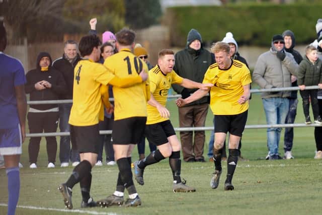 Golds players celebrate on their way to another FA Vase victory / Picture: Stephen Goodger