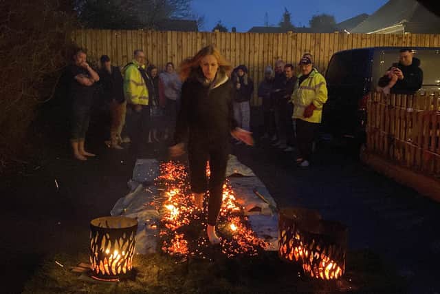 Solicitor Lissie Squires from Britton & Time in Hove doing the Valentine's Firewalk for Worthing charity Care for Veterans