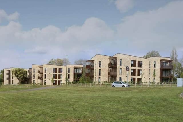 The proposed block of flats to the left pictured imposed on two of the three existing apartment blocks