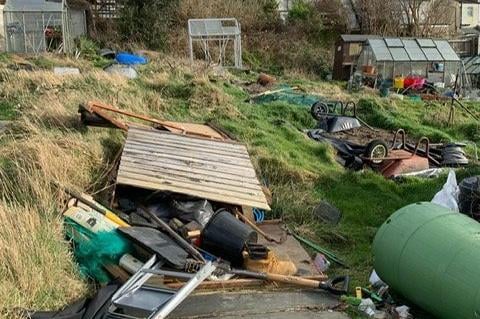 Storm Eunice destroyed young couple Connie Blench and James Keefe's shed and new greenhouse on their allotment in Paul’s field, Hastings. SUS-220221-092942001