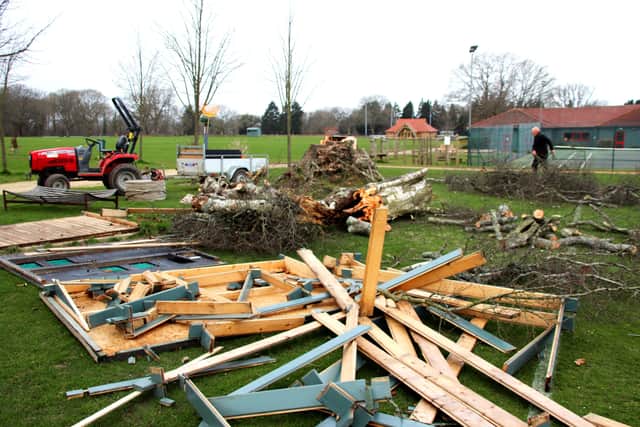 The remains of the silver birch and the scorer’s hut are cleared away at Highfield and Brookham School. SUS-220221-172025001