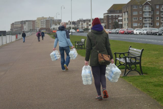 South East Water handing out bottles of water to residents outside Bexhill Sea Angling Club after Storm Eunice caused a lack of power to water pumping stations. SUS-220222-123058001