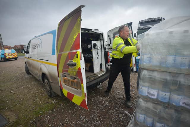 South East Water handing out bottles of water to residents outside Bexhill Sea Angling Club after Storm Eunice caused a lack of power to water pumping stations. SUS-220222-122925001