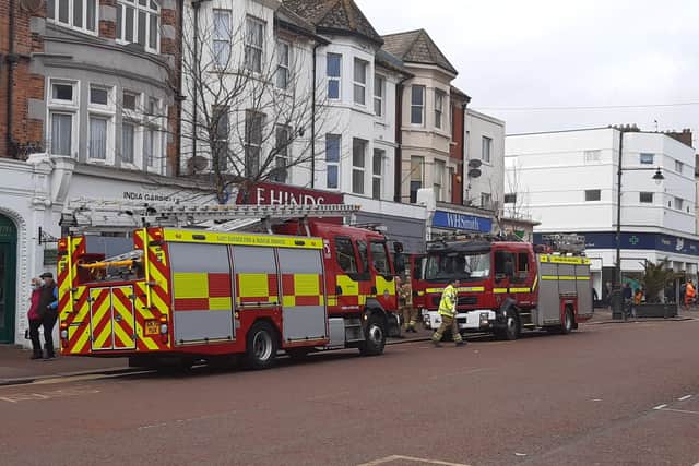 Firefighters at the scene in Bexhill town centre SUS-220223-155417001