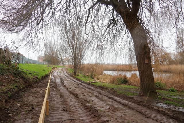 Contractors have started work on the pathway around the lake on the Western Road Side