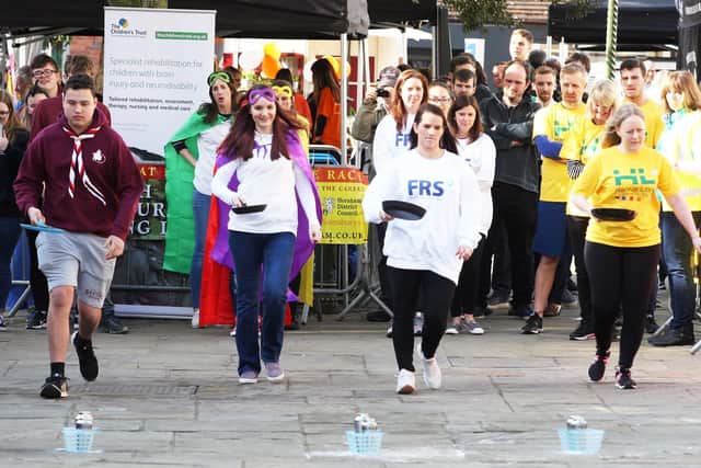 Action from the 2019 Horsham Charity Pancake Races. Picture by Derek Martin Photography and Art