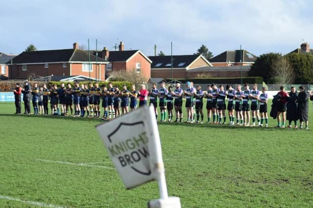 The teams stage a minute's silence in memory of the tragic Evesham player who passed away / Picture: Jess Brown