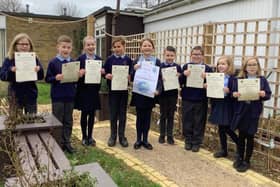 Southbourne Junior School pupils with their certificates of achievement