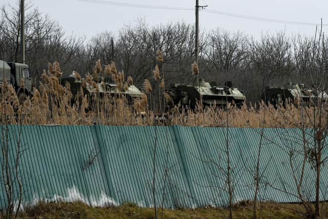 Russian military vehicles are seen loaded on train platforms some 50 km off the border with the self-proclaimed Donetsk People's Republic in Russia's southern Rostov region. (Photo by STRINGER / AFP) (Photo by STRINGER/AFP via Getty Images) SUS-220224-111514003