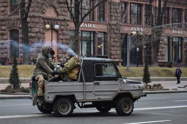 Right Sector militias gather outside the city hall prior to deploying on defensive positions  in Kyiv, Ukraine. Overnight, Russia began a large-scale attack on Ukraine, with explosions reported in multiple cities and far outside the restive eastern regions held by Russian-backed rebels. (Photo by Pierre Crom/Getty Images)