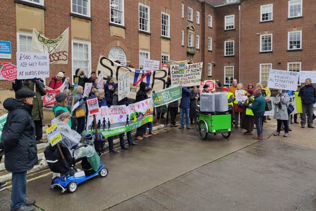 Campaigners against the Arundel Bypass grey route marched from Chichester Cross to County Hall to demonstrate their opposition to the National Highways plans. Image: Louise Higham
