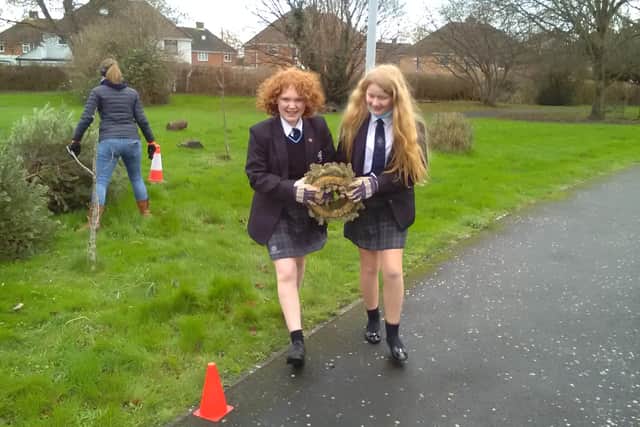 The Regis School’s Rights Respecting Ambassadors helped load and sort trees ready to be taken to be composted as part of the St Wilfrid's Hospice's scheme