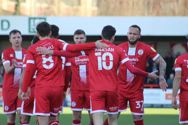 Crawley Town players celebrate after Ashley Nadesan's goal against Forest Green Rovers. Photo: Cory Pickford SUS-220226-160736001