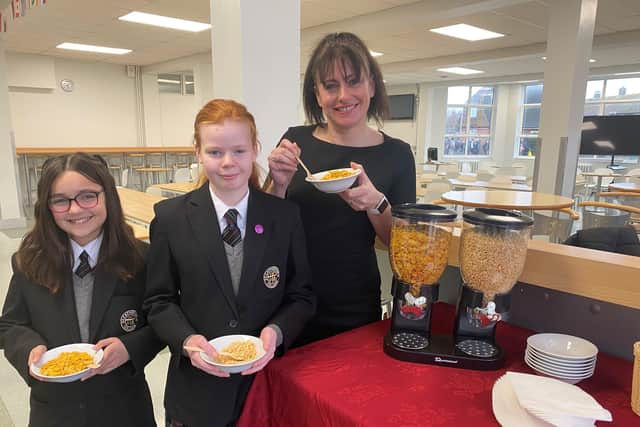 Hannah Simpson and Caitlyn Jones from Year 7 with deputy headteacher Sophie Thomas at St Catherine’s College. The college will be offering free breakfasts to students as part of the National School Breakfast Programme. SUS-220228-093121001