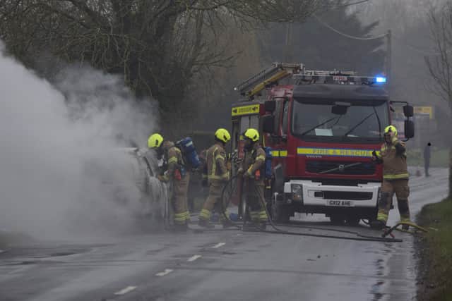 Fire crews attending the car fire in Ersham Road, Hailsham. Picture from Dan Jessup SUS-220103-132014001