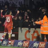 Ashley Nadesan celebrates his second goal in front of the Reds fans. Picture by Cory Pickford