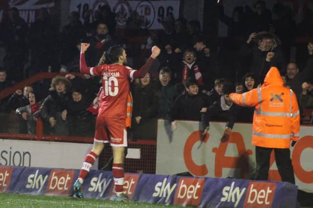 Ashley Nadesan celebrates his second goal in front of the Reds fans. Picture by Cory Pickford
