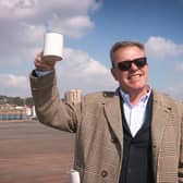 Suggs, from Madness, enjoying a cup of tea on Hastings pier in March 2016.