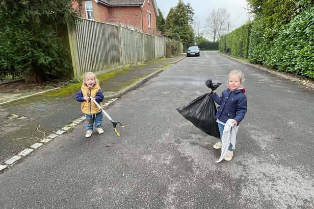 Seren and Hope clean up litter on Oakhurst Lane, Haywards Heath. Picture: Tim Bird.